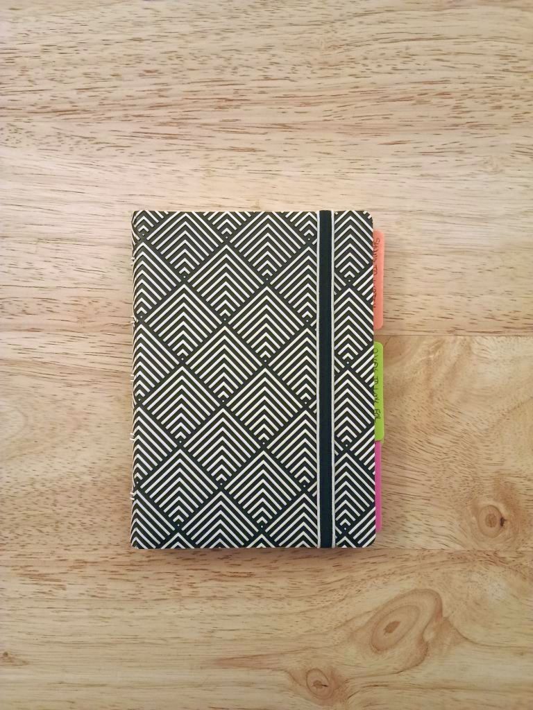 Filofax notebook with black and white diamond pattern cover