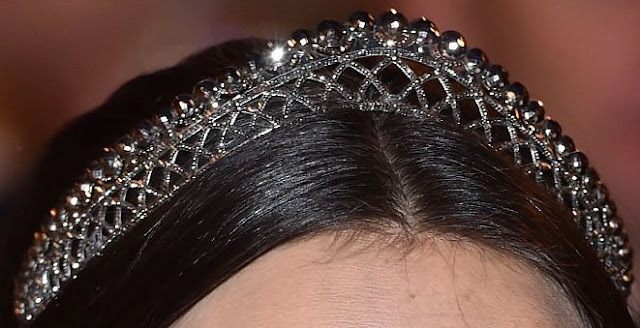 a bandeau style tiara made from cut steel. The top row is steel beads which are set on a lattice base.