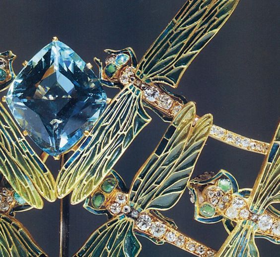 Close up image of the dragonfly tiara showing the diamond-shaped aquamarine and the dragonflies