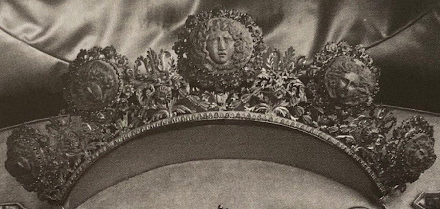 black and white photo of gold tiara with lava cameos