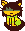 light orangish kitty with long brown hair on its head and the same hair on its tail. Kitty is wearing a green strip shirt, with 3 sections, the top and bottom being the same green and the middle a lighter almost yellow green.
