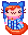 Tarry Kitty - made by Jug Orange kitty has a little hat with ear flaps that have little pink pompoms on the end. Kitty has a pink collar with a bell and is wearing what looks like a blue and white striped sweater.
