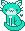 Cyan colored kitty with white chest, feet, ears and muzzle. There is a small cyan heart to the right.